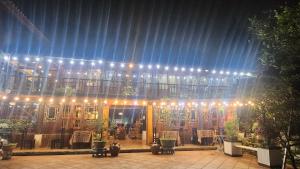 a building with lights and plants in front of it at Sapa Garden Bungalow in Sa Pa