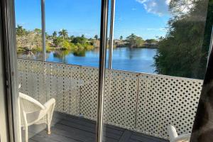 a balcony with a view of a river at Marco Island Lakeside Inn in Marco Island