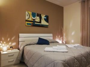 Posteľ alebo postele v izbe v ubytovaní B&B Li Figuli