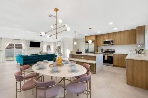 a kitchen and living room with a table and chairs at Rather Be Designer Casa by Rather Be Properties in Desert Hot Springs