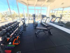 een fitnessruimte met rijen loopvlakken in een gebouw bij Casas Pepe Apartments & Spa- Adults Only in Playa del Inglés