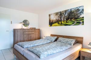 Säng eller sängar i ett rum på Bergblick Ferienwohnung