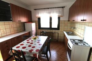 a kitchen with a table with a table cloth on it at Apartment Vera in Zambratija