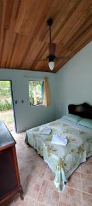 Ένα ή περισσότερα κρεβάτια σε δωμάτιο στο Pousada carrossel