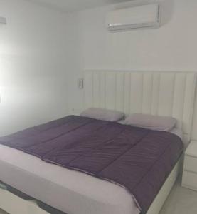 Ένα ή περισσότερα κρεβάτια σε δωμάτιο στο Centraal gelegen luxebungalow