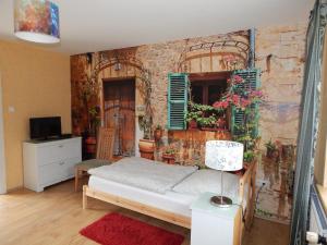 a bedroom with a bed and a wall with shutters at Ferienwohnung Zesch am See in Zossen