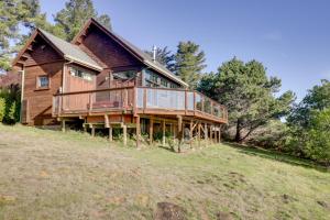 a large wooden house on top of a hill at Romantic Ridgetop Escape with Hot Tub Near Mendocino in Albion
