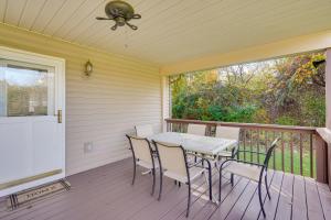 a patio with a table and chairs on a deck at Charming Howard Getaway with Deck, 1 Mi to Lake! in Howard