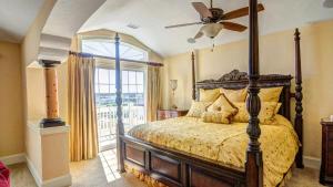 a bedroom with a bed and a ceiling fan at OCEANFRONT, 18 BRs, ELEV, Theater, Rec Room, Poolside Bar, Luxury, EP204, Grande Ritz Carolina in Kill Devil Hills +54 photos