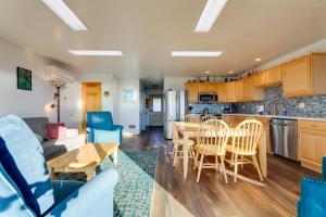 a kitchen and living room with a table and chairs at Sanderling Sea Cottages, Unit 10 in Waldport +25 photos