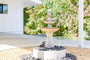 a fountain in the yard of a house at Lakeside Haven in Gainesville