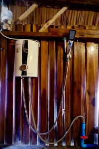 a pay phone is hooked up to a wall at Lanta Marina Resort By Mam&Mod in Ko Lanta