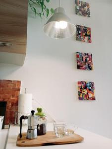 a kitchen counter with a coffee pot on a cutting board at Santa Lucia Home in Naples