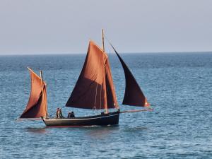 two people on a sail boat in the ocean at L'Albatros in Le Tréport +3 photos