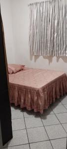 Ein Bett oder Betten in einem Zimmer der Unterkunft Apartamento perto da praia de Itaparica
