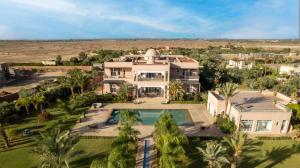 an aerial view of a large house with a swimming pool at The Levantine in Marrakesh