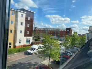 a view from a window of a parking lot at Modern Spacious 4 Bed House By Icon Living Properties Short Lets & Serviced Accommodation Reading With Free Parking in Reading