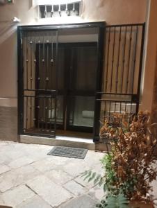 a black gate on a building at Casa Chiaretta in Palermo +39 photos