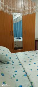 Postel nebo postele na pokoji v ubytování PagersHome Suites - Classic Nyarutarama