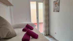 Postel nebo postele na pokoji v ubytování Apartamentos Séneca junto al Centro