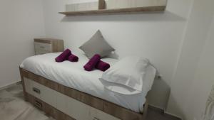 Postel nebo postele na pokoji v ubytování Apartamentos Séneca junto al Centro