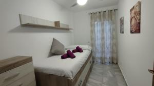 Posteľ alebo postele v izbe v ubytovaní Apartamentos Séneca junto al Centro