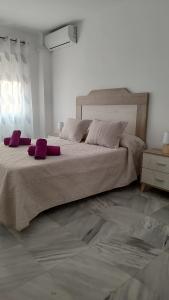 Postel nebo postele na pokoji v ubytování Apartamentos Séneca junto al Centro