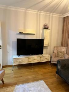 a living room with a large flat screen tv at Gulev in Istanbul