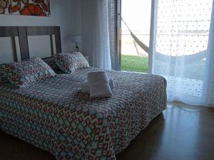 A bed or beds in a room at Chacras del mar