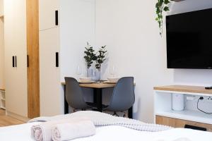 A bed or beds in a room at MyMozart Apartments Prague by Rentero Property