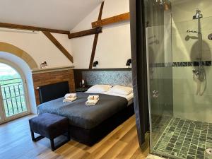 a bedroom with a bed and a glass shower at Stary Folwark Machnice in Machnice +150 photos