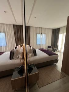 Letto o letti in una camera di Hotel Ben Batouta - Tanger