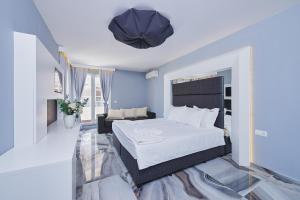 A bed or beds in a room at Botabara Del Mar Boutique