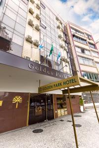 a hotel with a sign in front of a building at Hotel Golden Park Rio de Janeiro Aeroporto By Nacional Inn in Rio de Janeiro