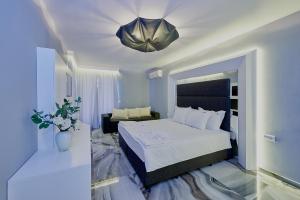 A bed or beds in a room at Botabara Del Mar Boutique