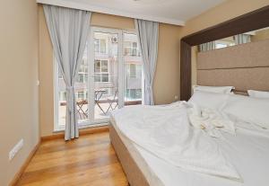 A bed or beds in a room at Botabara Del Mar Boutique