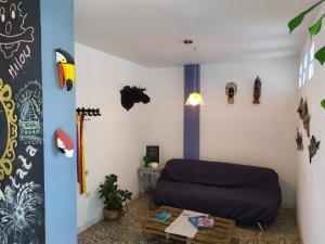 a living room with a bed and a table at Casa Almendros in Cartagena de Indias +12 photos