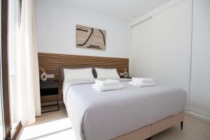 Postel nebo postele na pokoji v ubytování Villa Boja - Santa Rosalia Lake & Life Resort BY COELI HOLIDAYS + 24 fotografií