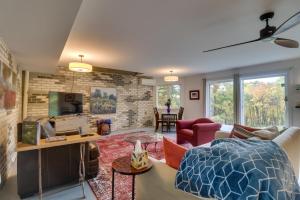 a living room with a brick wall at Renovated Studio on 5 Acres - Near Vineyards! in Crozet
