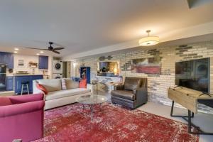 a living room with a couch and a tv at Renovated Studio on 5 Acres - Near Vineyards! in Crozet