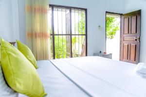 Giường trong phòng chung tại Paddy Field View Resort