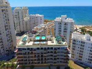 an aerial view of a building in front of the ocean at Dream Nest in Armação de Pêra