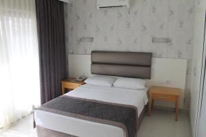 Кровать или кровати в номере Ida Hotel