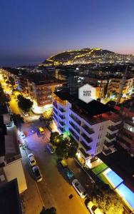 an overhead view of a city at night at Kadeer Hotel in Alanya
