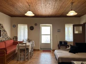a living room with a couch and a table at Dreamcatcher in Makrikhórion
