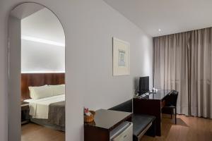 Postel nebo postele na pokoji v ubytování Orla Copacabana Hotel