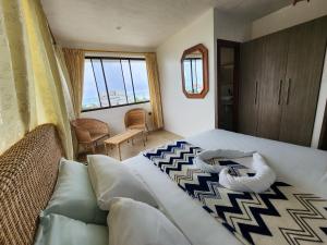 Postel nebo postele na pokoji v ubytování Hostal Poseidon