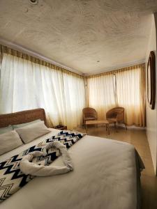 Postel nebo postele na pokoji v ubytování Hostal Poseidon