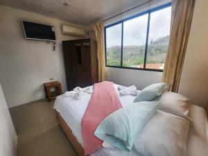 Postel nebo postele na pokoji v ubytování Hostal Poseidon