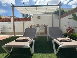 A patio or other outdoor area at COZY, Beach House , by MAHBOVILLAS